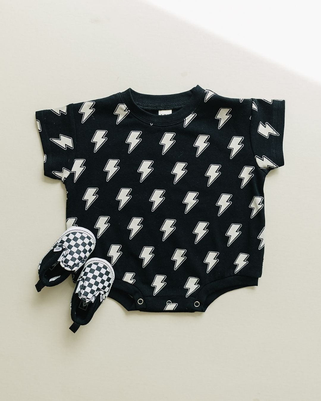 Short Sleeve Bubble Romper | Black Bolts - HoneyBug